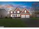 Beautiful two-story brick home with a manicured lawn, two-car garage, and a welcoming front porch at 3967 Bellingrath Main Nw, Kennesaw, GA 30144