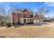 Charming brick home with a manicured lawn and three car garage at 3967 Bellingrath Main Nw, Kennesaw, GA 30144