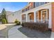 Inviting front porch with brick columns and trim at 3967 Bellingrath Main Nw, Kennesaw, GA 30144