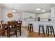 Eat-in kitchen featuring a breakfast bar, stainless appliances, and a cozy dining area at 3967 Bellingrath Main Nw, Kennesaw, GA 30144