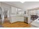 A bright eat-in kitchen with white cabinetry, stainless steel appliances, and an open view into the dining area at 3967 Bellingrath Main Nw, Kennesaw, GA 30144