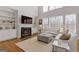 Stylish living room showcasing a fireplace, built-in shelves, and large windows for natural light at 3967 Bellingrath Main Nw, Kennesaw, GA 30144