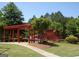 Community playground area with play structures, picnic shelter, and lush green surroundings at 3967 Bellingrath Main Nw, Kennesaw, GA 30144