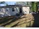 Backyard exterior with brick, stairs, and a small patio. Includes an air conditioning unit at 263 Banberry Se Dr, Atlanta, GA 30315