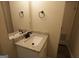 Stylish half bath features granite countertop vanity and modern fixtures at 263 Banberry Se Dr, Atlanta, GA 30315
