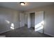 This bedroom features a closet, neutral walls, carpeted floors, and natural light from window at 263 Banberry Se Dr, Atlanta, GA 30315