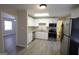 Modern kitchen boasts stainless steel appliances, granite countertops, and white cabinetry at 263 Banberry Se Dr, Atlanta, GA 30315