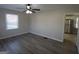 Well-lit living room with modern flooring, a ceiling fan, and views to the kitchen at 263 Banberry Se Dr, Atlanta, GA 30315