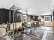 Spacious basement gym with rubber floor, gym equipment, and weight rack at 71 Russell Rd, Mcdonough, GA 30252