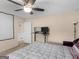 A bedroom with carpet, ceiling fan, bed and desk at 71 Russell Rd, Mcdonough, GA 30252