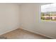 Bedroom featuring neutral carpet, natural light, and a view of the outdoors at 71 Russell Rd, Mcdonough, GA 30252