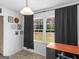 Bright dining area featuring a large window with curtains and a table with chairs at 71 Russell Rd, Mcdonough, GA 30252