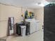Basement laundry area with washer, dryer, mirror, and storage at 71 Russell Rd, Mcdonough, GA 30252