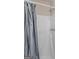 A white shower with silver fixtures and gray curtain at 71 Russell Rd, Mcdonough, GA 30252