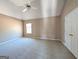 Spacious primary bedroom features neutral walls, large window, and plush carpet at 159 Courtneys Ln, Fayetteville, GA 30215