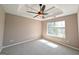 Bedroom with trey ceiling, ceiling fan and window for natural light at 159 Courtneys Ln, Fayetteville, GA 30215