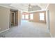 Large, carpeted bedroom with neutral walls, trey ceiling and recessed lights at 159 Courtneys Ln, Fayetteville, GA 30215