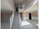 Bright foyer features a staircase and an open floor plan leading to other rooms at 159 Courtneys Ln, Fayetteville, GA 30215