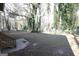 Expansive backyard surrounded by mature trees at 3122 Latona Sw Dr, Atlanta, GA 30354
