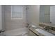 Clean bathroom with stylish tile and a granite-topped vanity at 3122 Latona Sw Dr, Atlanta, GA 30354