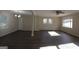 Bright, open-concept living room featuring hardwood floors, large windows, and modern lighting at 3122 Latona Sw Dr, Atlanta, GA 30354