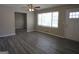 Bright living room with stylish gray flooring, a ceiling fan, and great natural light at 619 Church Nw St, Atlanta, GA 30318