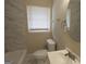 Updated bathroom features a tub-shower combo and modern fixtures at 1923 Rosewood Rd, Decatur, GA 30032