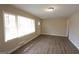 Inviting living room with large windows, new flooring, and fresh paint at 1923 Rosewood Rd, Decatur, GA 30032