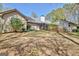 Exterior view of a home with a fenced backyard and a screened-in patio at 110 Sycamore Bnd, Fayetteville, GA 30214