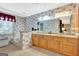 Spacious bathroom featuring & sinks, a bathtub, and ample counter space at 110 Sycamore Bnd, Fayetteville, GA 30214