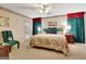 Comfortable bedroom featuring floral accents, and a door to the outside at 110 Sycamore Bnd, Fayetteville, GA 30214