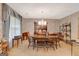 Formal dining room with wooden table, chairs, chandelier, and wallpaper at 110 Sycamore Bnd, Fayetteville, GA 30214