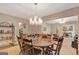 Formal dining room with chandelier and a dining table ready for entertaining guests at 110 Sycamore Bnd, Fayetteville, GA 30214