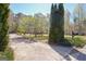 Driveway and front yard with greenery, bushes, and house number at 110 Sycamore Bnd, Fayetteville, GA 30214