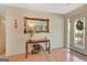 Inviting entryway with table, mirror, and doorway for seamless transition at 110 Sycamore Bnd, Fayetteville, GA 30214
