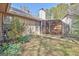 Exterior of home with a sunroom featuring glass ceiling and backyard at 110 Sycamore Bnd, Fayetteville, GA 30214