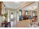 Welcoming foyer with decorative door, hardwood floors, and adjacent living space at 110 Sycamore Bnd, Fayetteville, GA 30214