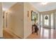 Inviting foyer featuring a decorative table and a glass-paneled front door that allows natural light to flood the space at 110 Sycamore Bnd, Fayetteville, GA 30214