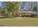Charming brick home with well-maintained lawn and mature landscaping at 110 Sycamore Bnd, Fayetteville, GA 30214