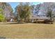 Well-maintained brick home with a spacious front yard and mature trees at 110 Sycamore Bnd, Fayetteville, GA 30214