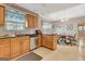 Efficient kitchen with stainless steel appliances, light cabinetry, and an adjacent dining area at 110 Sycamore Bnd, Fayetteville, GA 30214