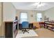 Bright office with a ceiling fan, neutral walls, window, and ample space for a desk and bookshelves at 110 Sycamore Bnd, Fayetteville, GA 30214