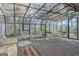 Sunroom with glass ceiling featuring seating areas and backyard view at 110 Sycamore Bnd, Fayetteville, GA 30214