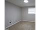 Cozy bedroom with neutral walls, soft carpeting, and natural light from a window at 2509 Appomattox Dr, Decatur, GA 30034