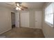 Bedroom with a ceiling fan, carpet flooring, and closet for ample storage at 2509 Appomattox Dr, Decatur, GA 30034