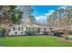 Charming single-story home with well-maintained lawn and mature trees providing shade at 2509 Appomattox Dr, Decatur, GA 30034