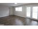 Bright living room with sleek vinyl floors and French doors leading to the outdoors at 2509 Appomattox Dr, Decatur, GA 30034
