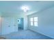 A serene bedroom showcases neutral carpet and an ensuite bathroom at 2282 Tiffany Ct, Jonesboro, GA 30236