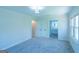 A serene bedroom showcasing neutral carpet and an ensuite bathroom at 2282 Tiffany Ct, Jonesboro, GA 30236