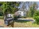 Charming two-story home features a mailbox near a well-manicured lawn, complemented by mature trees and shrubbery at 2282 Tiffany Ct, Jonesboro, GA 30236